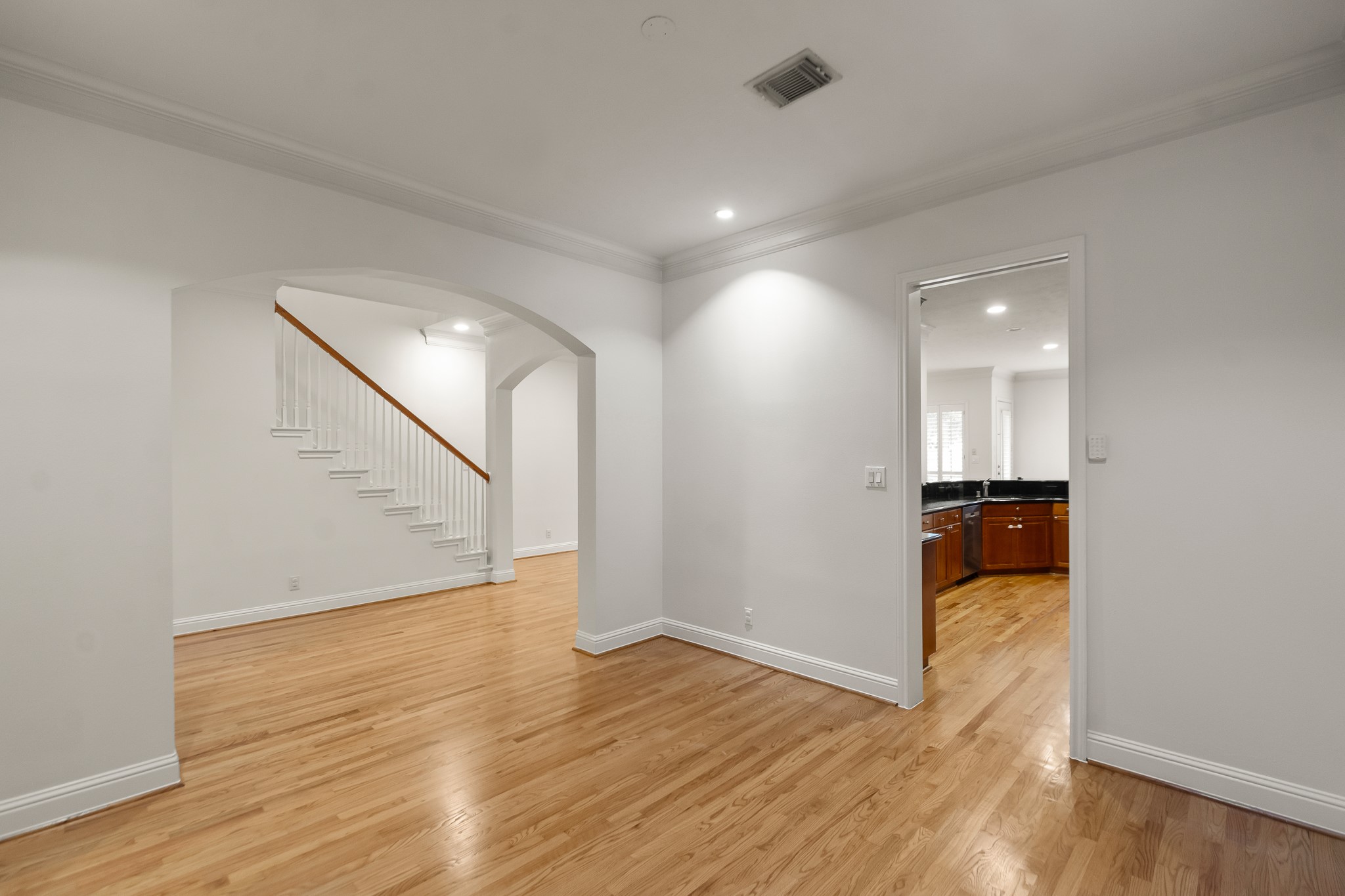 5351 McCulloch Circle Houston, TX 77056 - Photo 8 of 42 a view of a room with wooden floor and staircase