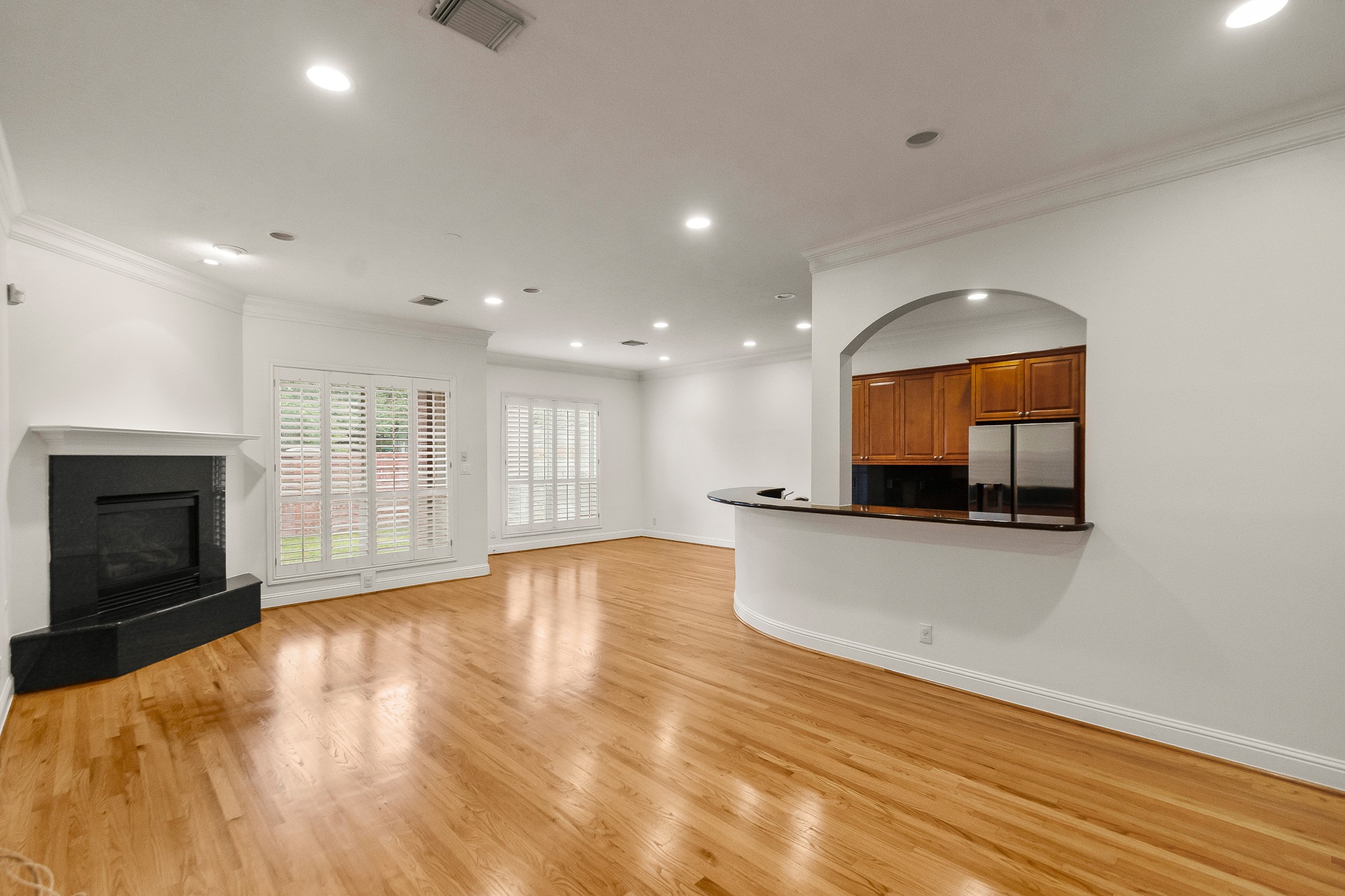 5351 McCulloch Circle Houston, TX 77056 - Photo 10 of 42 a view of empty room with wooden floor and fireplace
