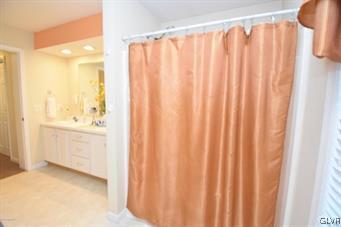 144 Indian Trail Road Jim Thorpe, PA 18229 - Photo 15 of 46 a bathroom with a shower curtain and a sink