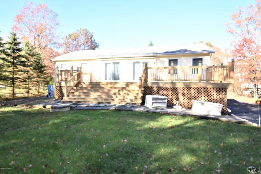 144 Indian Trail Road Jim Thorpe, PA 18229 - Photo 29 of 46 a view of a house with a yard porch and sitting area