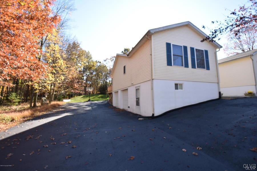 144 Indian Trail Road Jim Thorpe, PA 18229 - Photo 36 of 46 a view of a house with backyard