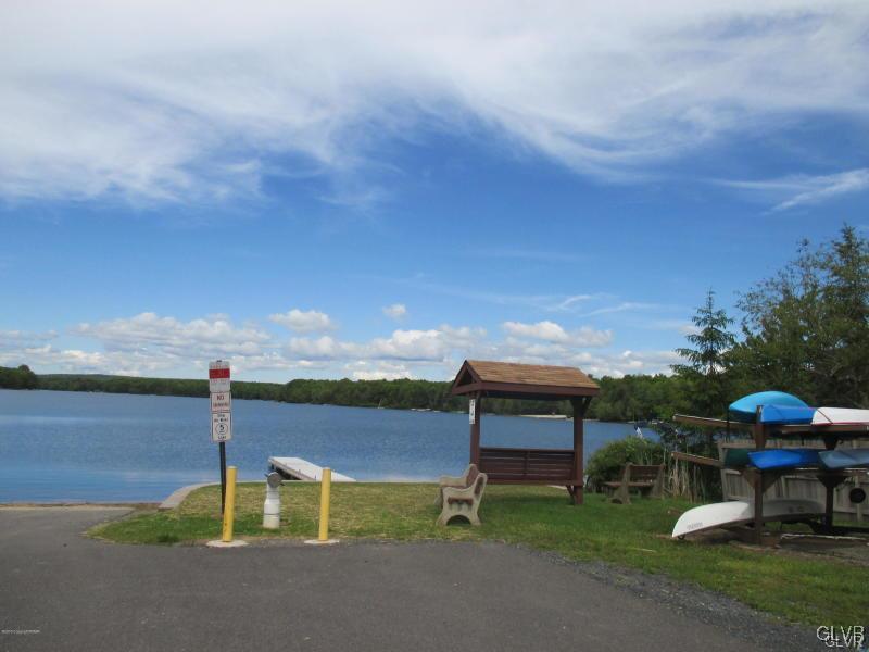 144 Indian Trail Road Jim Thorpe, PA 18229 - Photo 39 of 46 a garden with a bench and lake view