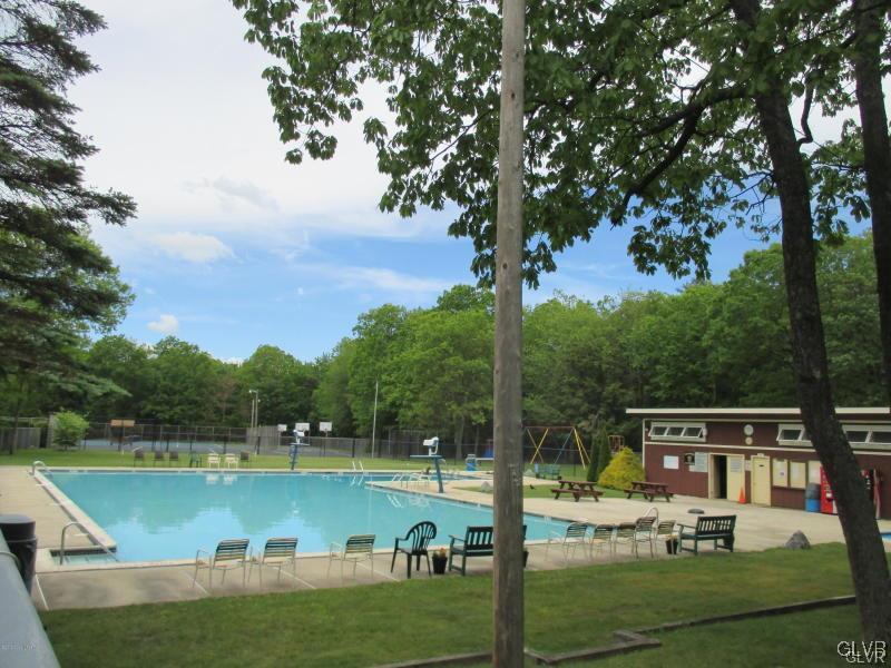 144 Indian Trail Road Jim Thorpe, PA 18229 - Photo 44 of 46 a view of a lake with houses in the back