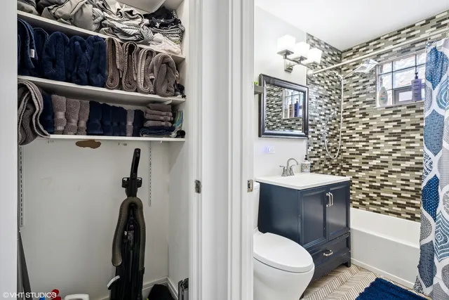 a bathroom with a toilet a sink and a shower