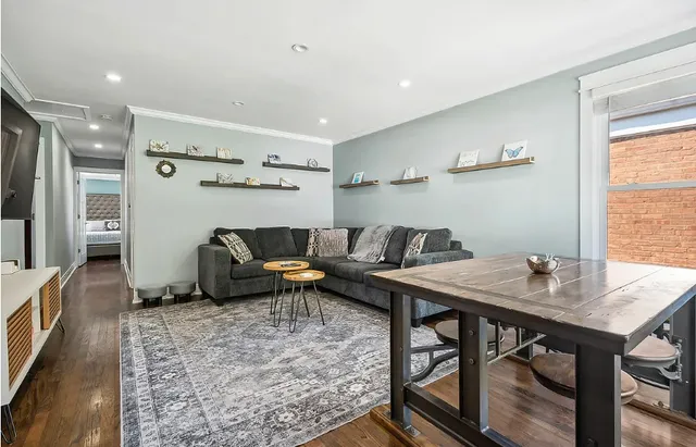 a living room with furniture and a table
