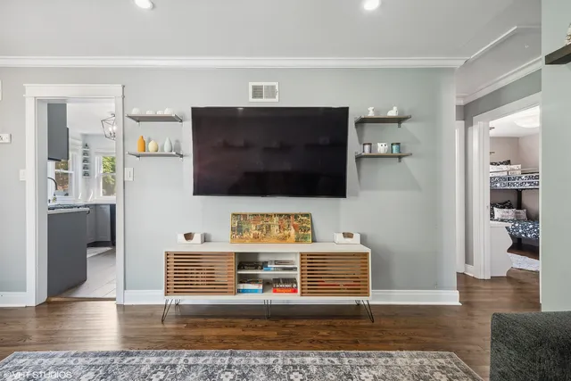 a living room with a flat screen tv and outdoor view