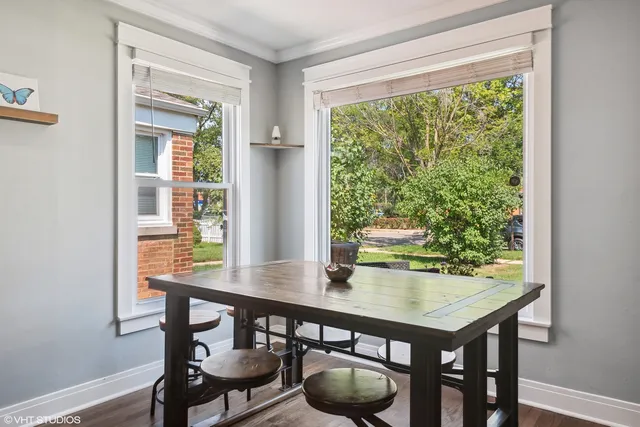a view of a dining room with furniture and window