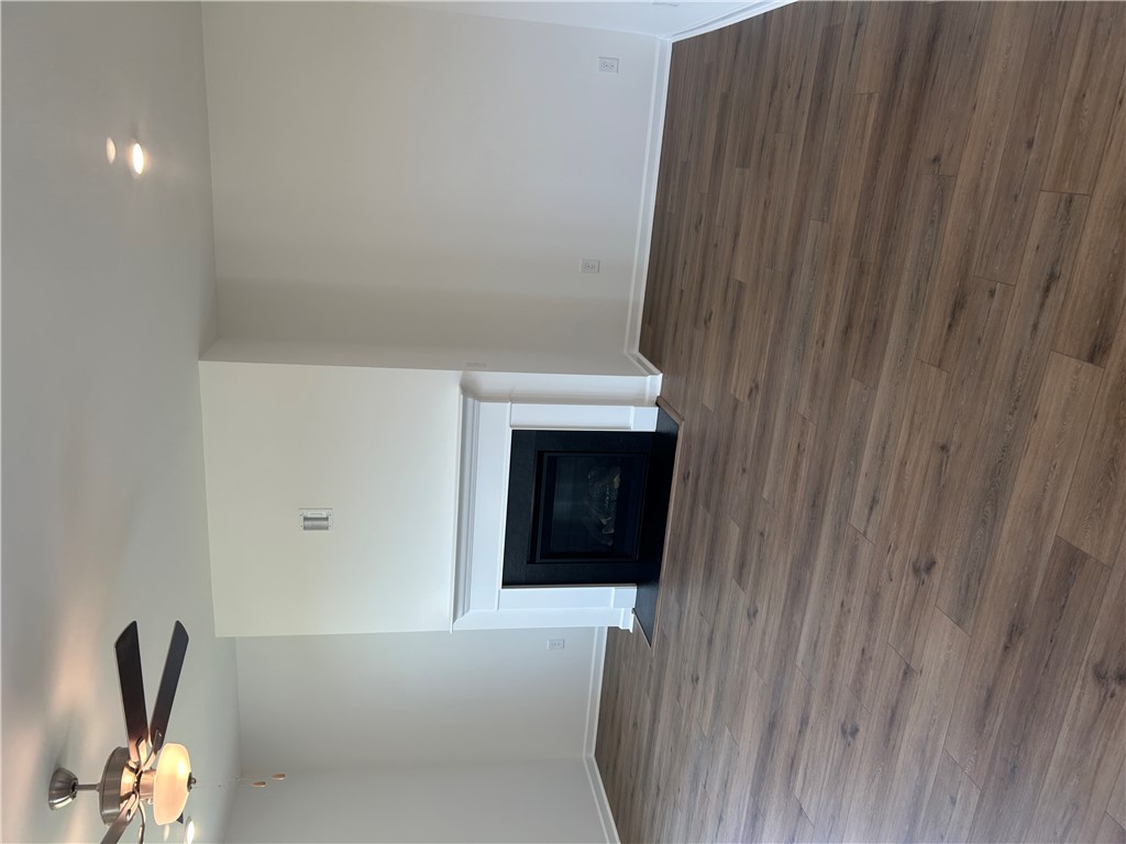 211 Bellflower Lane Anderson, SC 29625 - Photo 14 of 28 A refined fireplace and wide plank flooring complete this spacious living room.