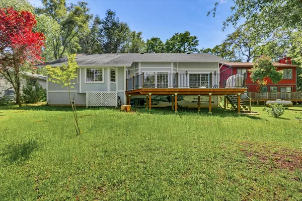 an aerial view of a house with a yard