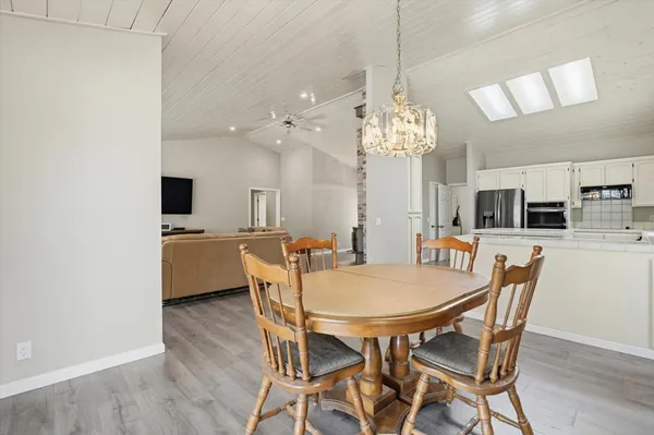 a view of a dining room with furniture window and wooden floor