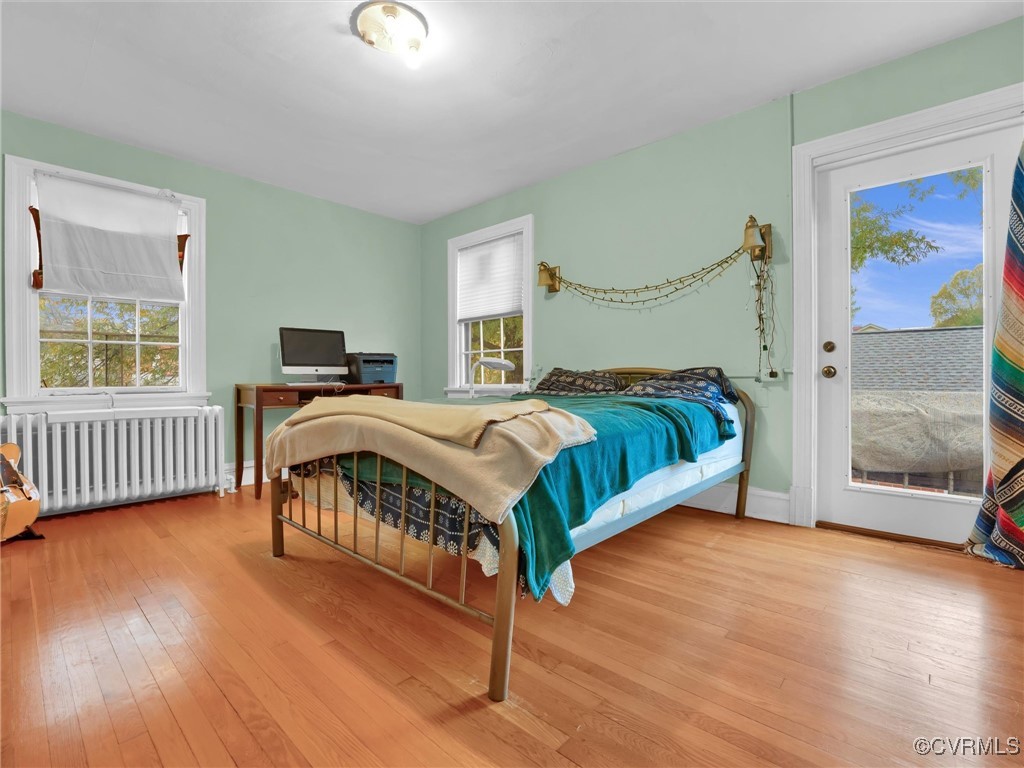 4402 Brook Road Richmond, VA 23227 - Photo 22 of 40 Bedroom featuring access to outside, light hardwoo