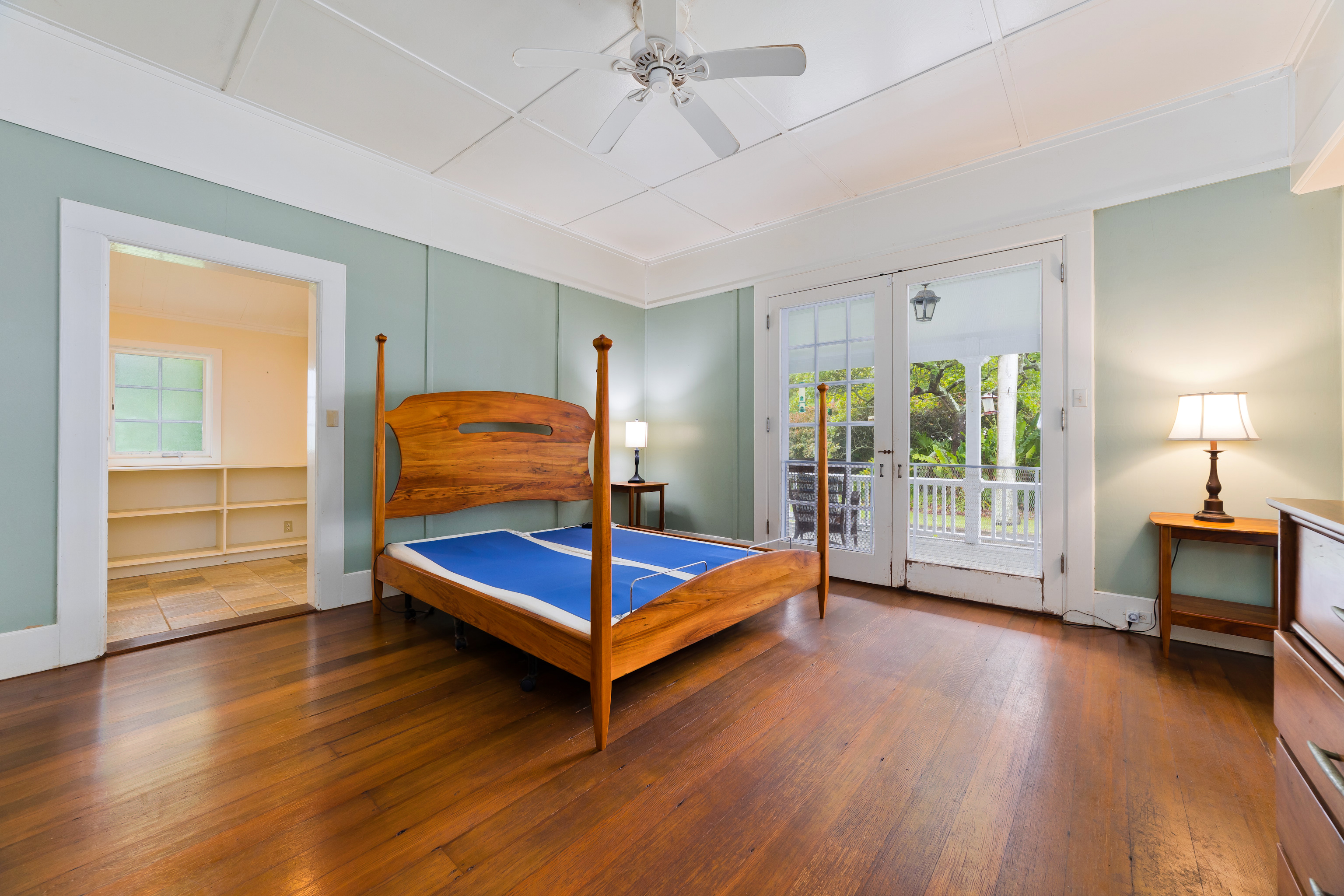54-333 Union Mill Road Kapaau, HI 96755 - Photo 12 of 30 a bedroom with a bed and wooden floor