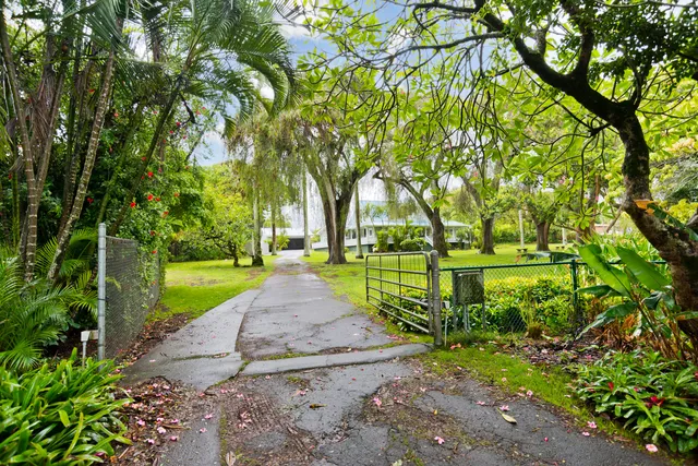 an aerial view of residential house with outdoor space and swimming pool