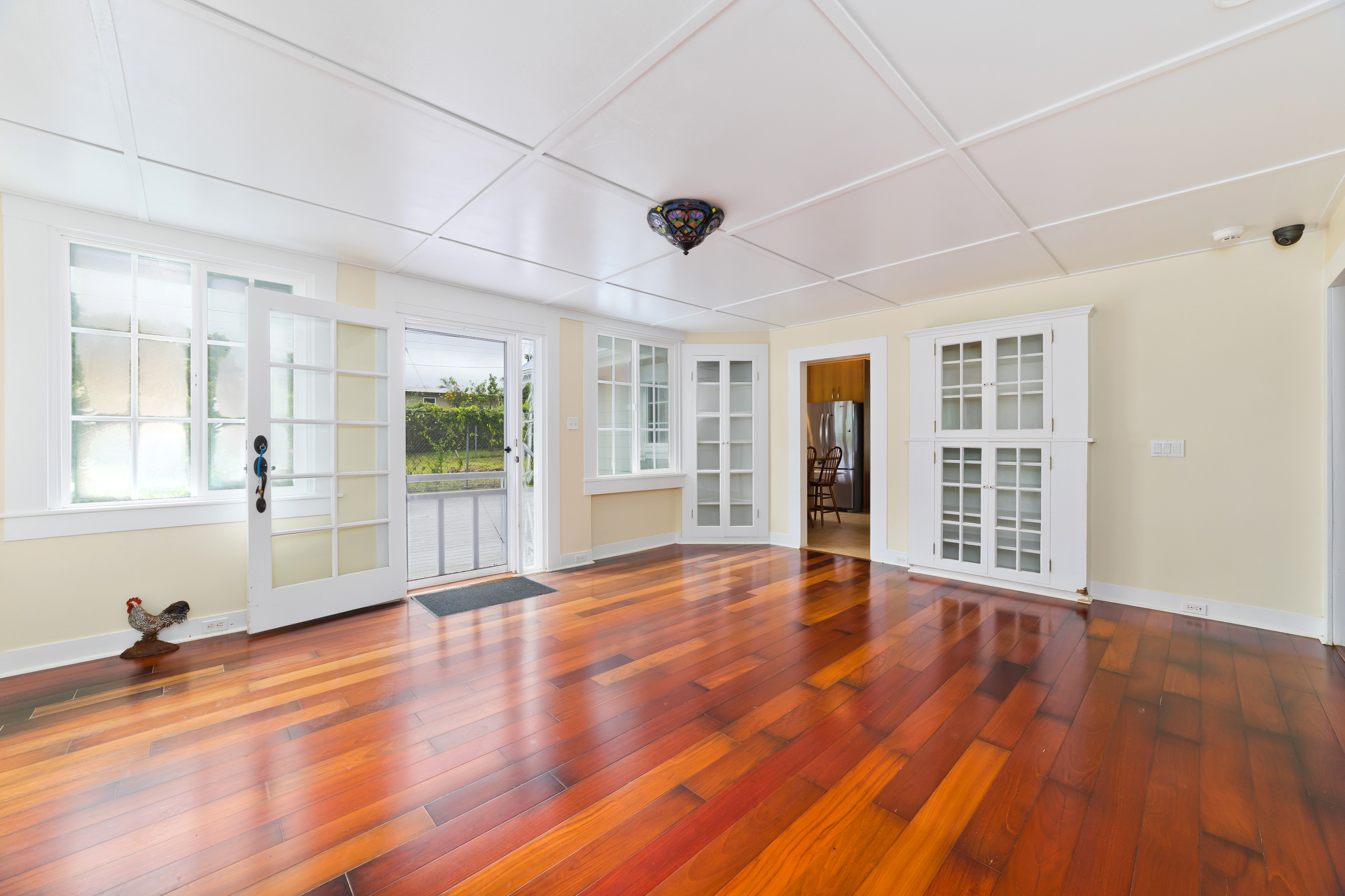 54-333 Union Mill Road Kapaau, HI 96755 - Photo 9 of 30 a view of an empty room with wooden floor and a window