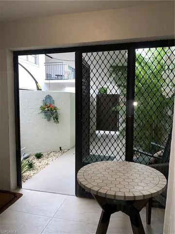 a table that has a table and a chair with wooden floor