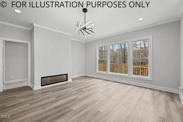 a view of a room with wooden floor and windows