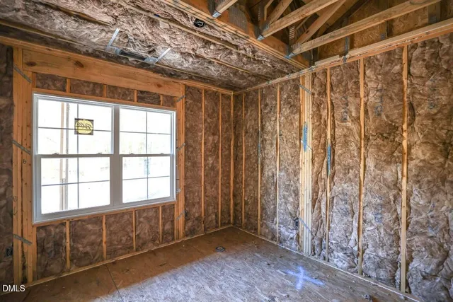 a view of hallway with wooden floor