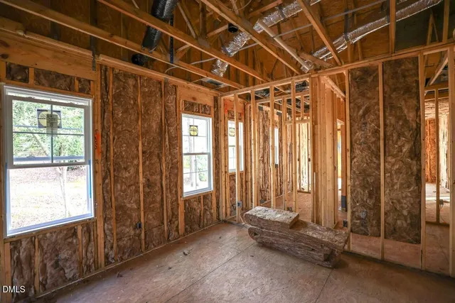 a kitchen with kitchen island a stove a sink and a refrigerator