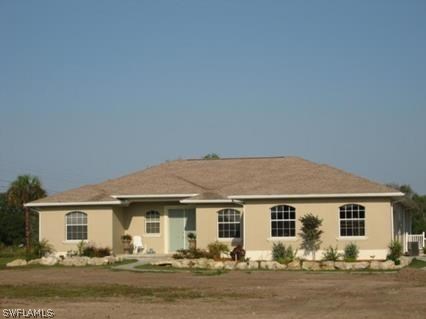 2800 Styles Road Alva, FL 33920 - Photo 1 of 3 a front view of a house with yard