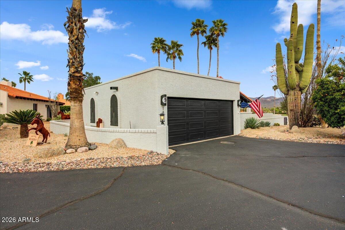 18810 East Chinle Drive Rio Verde, AZ 85263 - Photo 28 of 38 a front view of a house with a garage