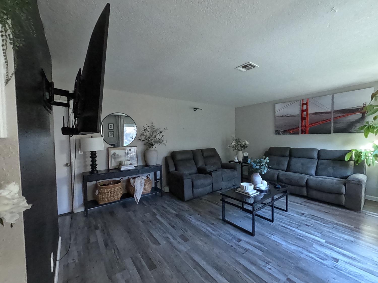 1920 Pontelli Court Stockton, CA 95207 - Photo 5 of 10 a living room with furniture and a wooden floor
