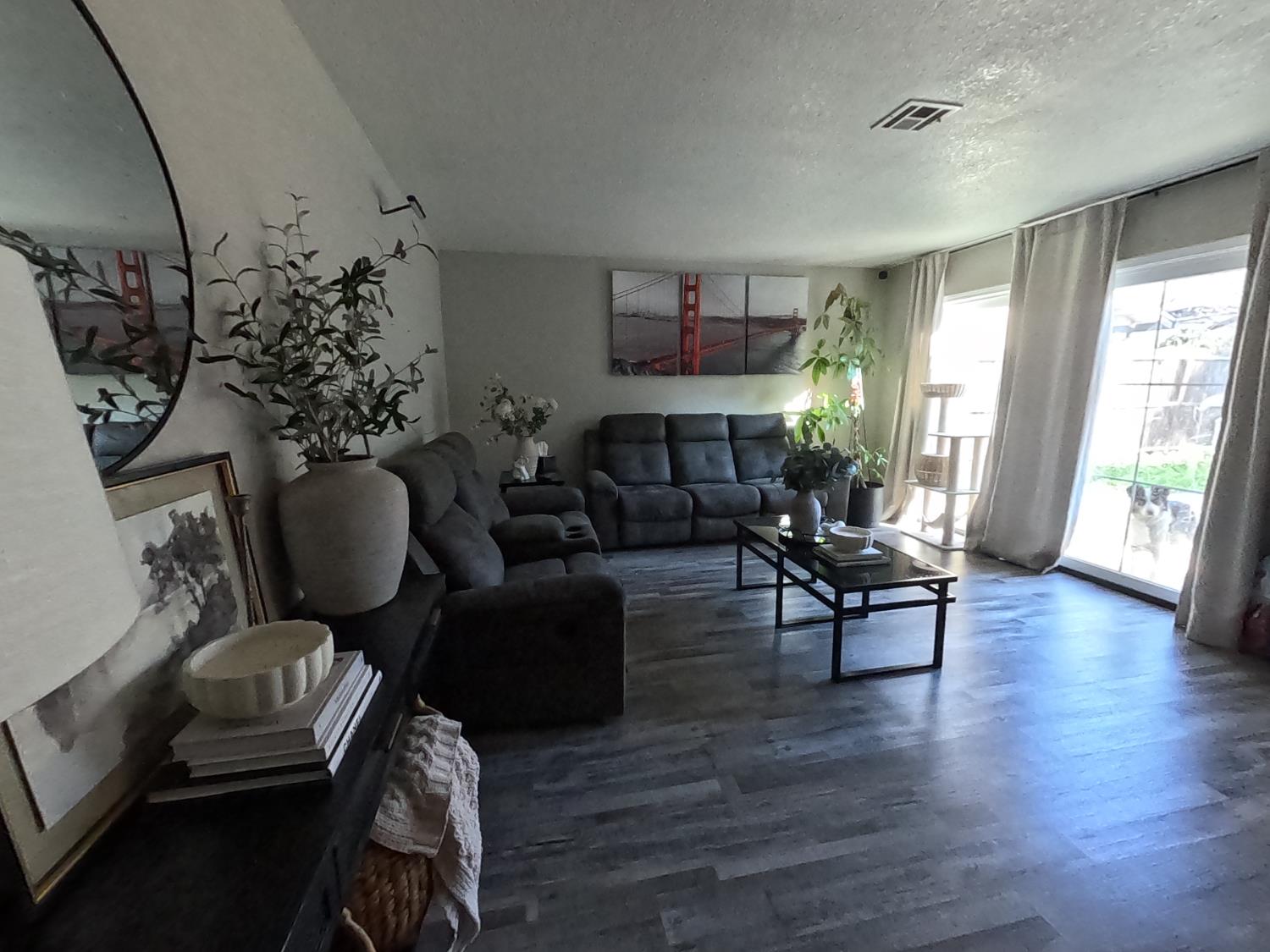 1920 Pontelli Court Stockton, CA 95207 - Photo 6 of 10 a living room with furniture rug and wooden floor