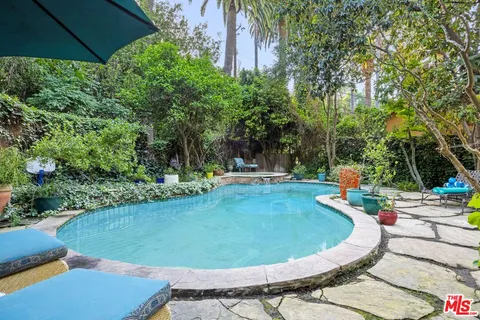 a view of a swimming pool in the backyard