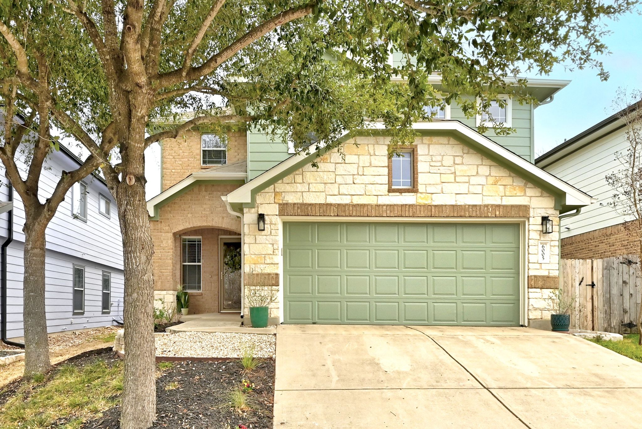a front view of a house with a garage