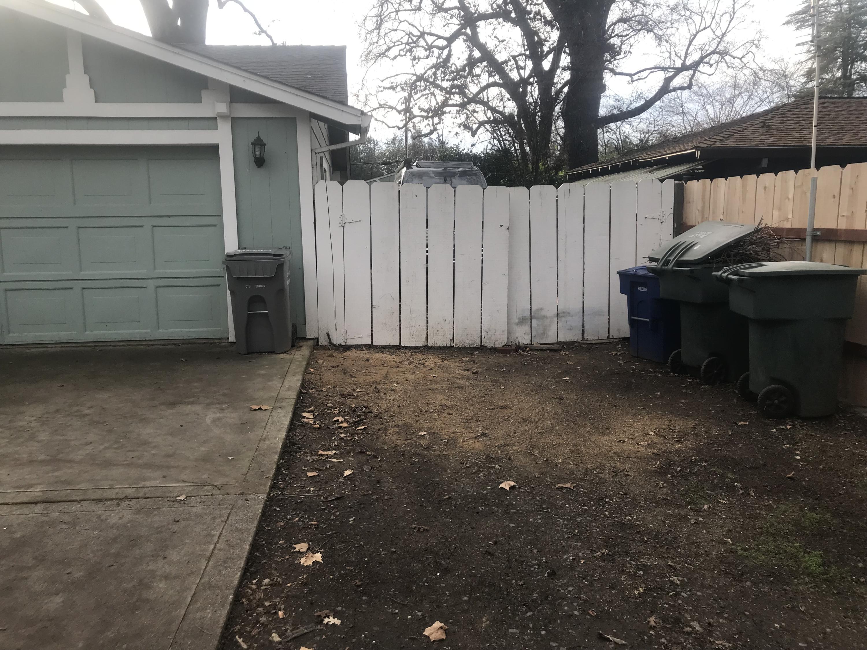 6730 Riverside Drive Redding, CA 96001 - Photo 8 of 23 a view of a house with a backyard