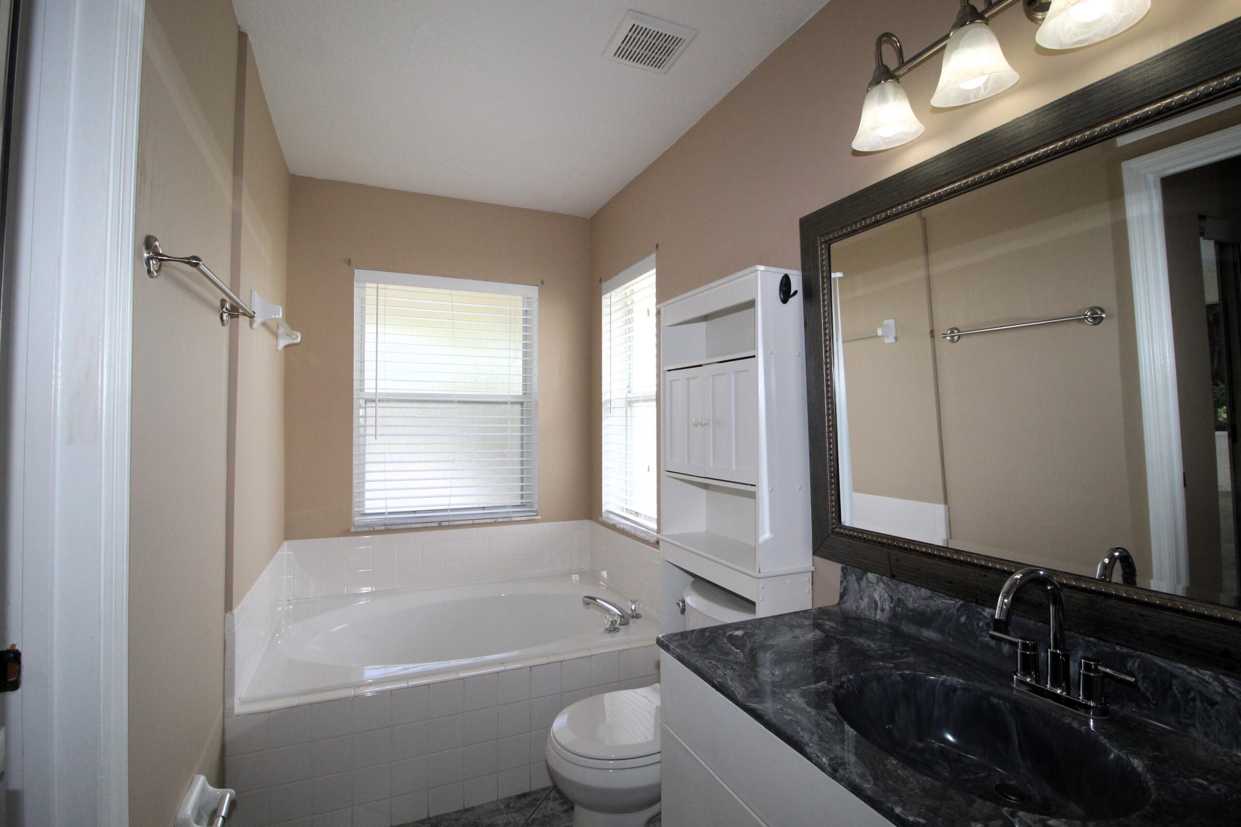 212 Southwest Ridgecrest Drive Port St. Lucie, FL 34953 - Photo 12 of 18 ensuite