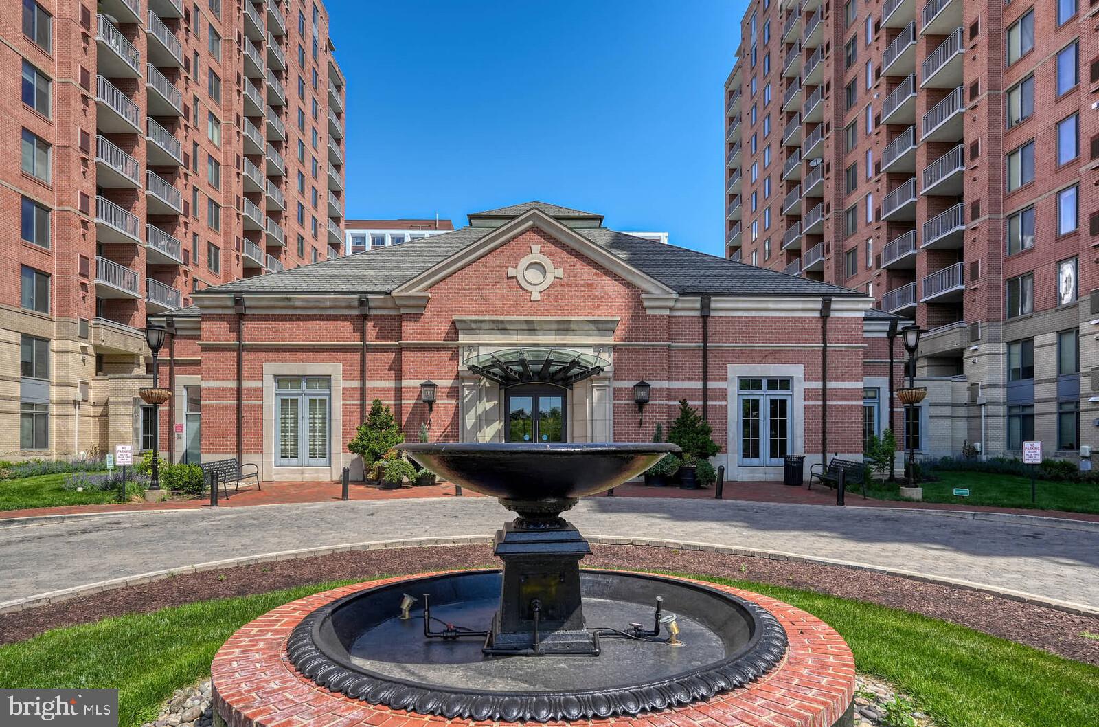 11710 Old Georgetown Road, Unit 429 North Bethesda, MD 20852 - Photo 1 of 40 a front view of a building with a garden and plants