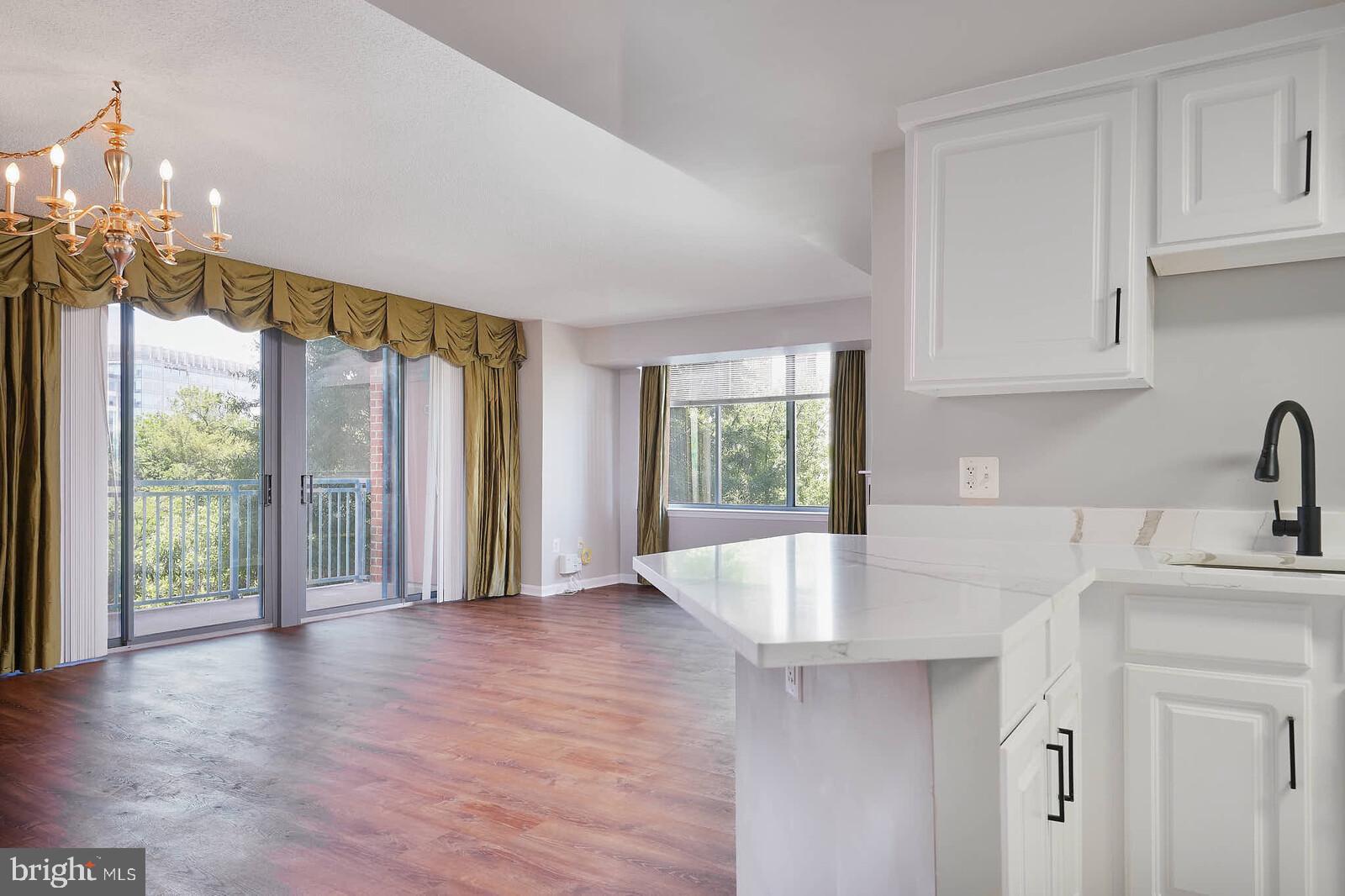 11710 Old Georgetown Road, Unit 429 North Bethesda, MD 20852 - Photo 2 of 40 a view of kitchen with granite countertop a sink and a window