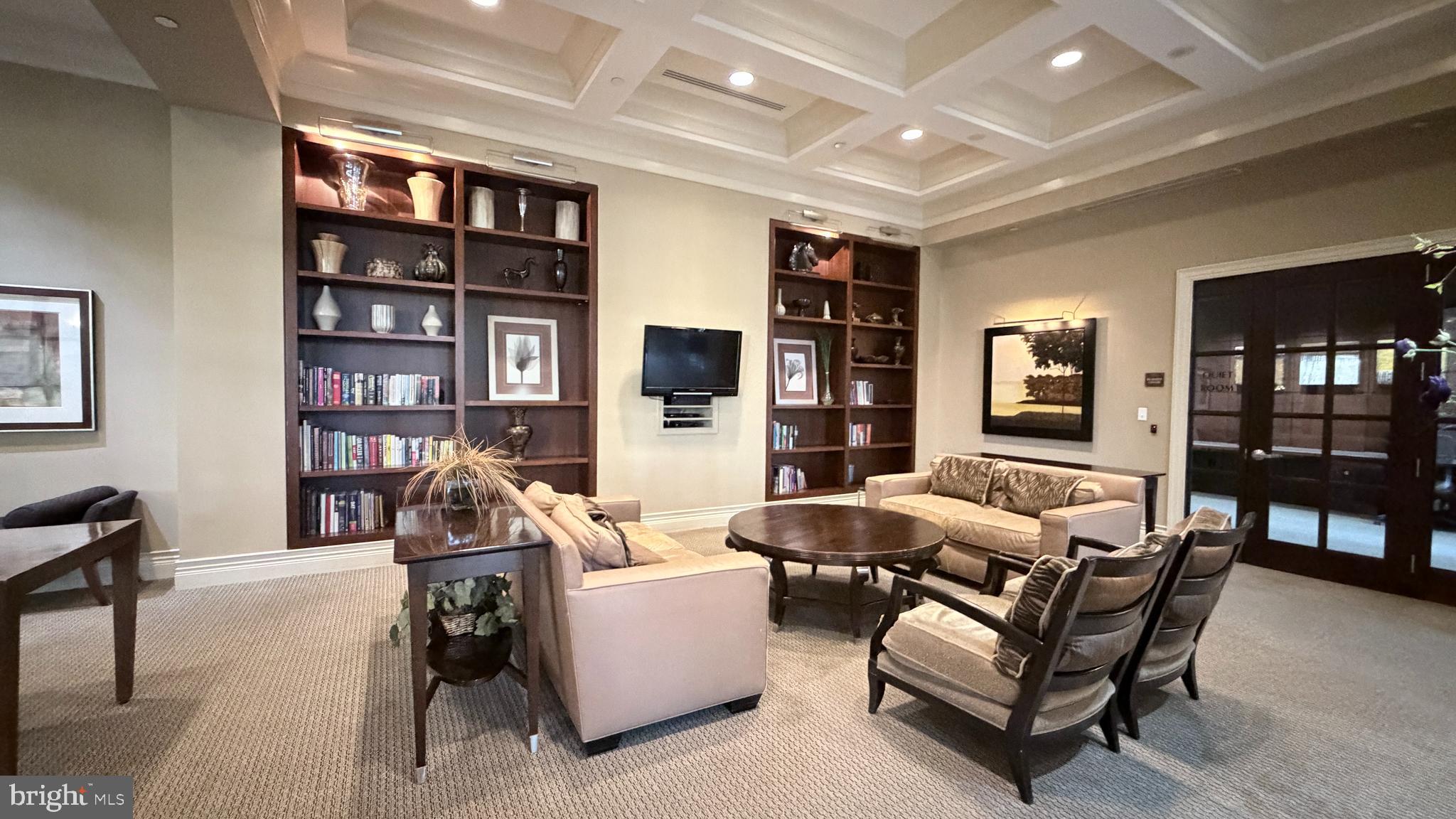11710 Old Georgetown Road, Unit 429 North Bethesda, MD 20852 - Photo 31 of 40 a living room with furniture and a bookshelf
