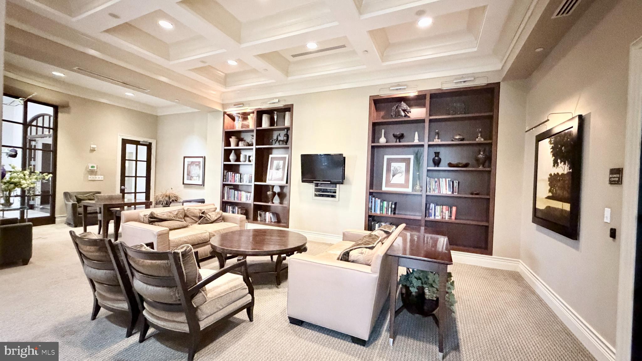 11710 Old Georgetown Road, Unit 429 North Bethesda, MD 20852 - Photo 32 of 40 a living room with furniture a rug and a bookshelf