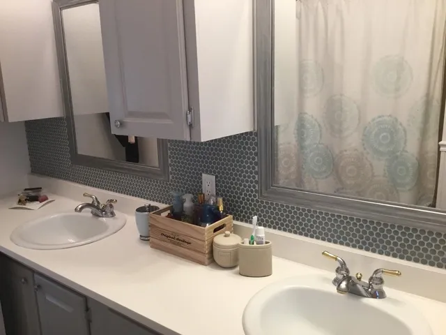 a bathroom with a sink and a mirror
