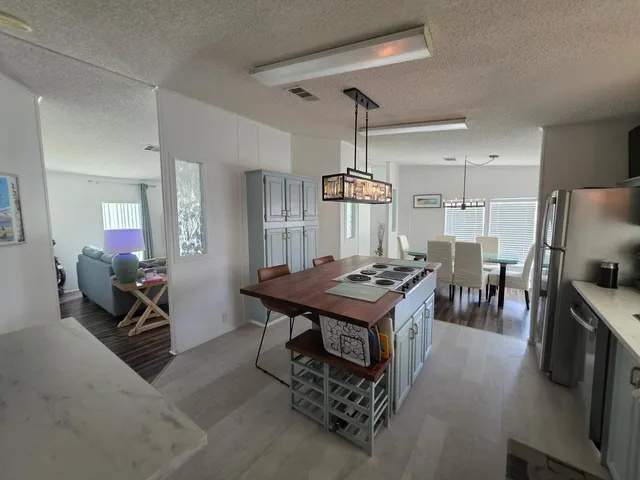 a kitchen with a table and chairs in it