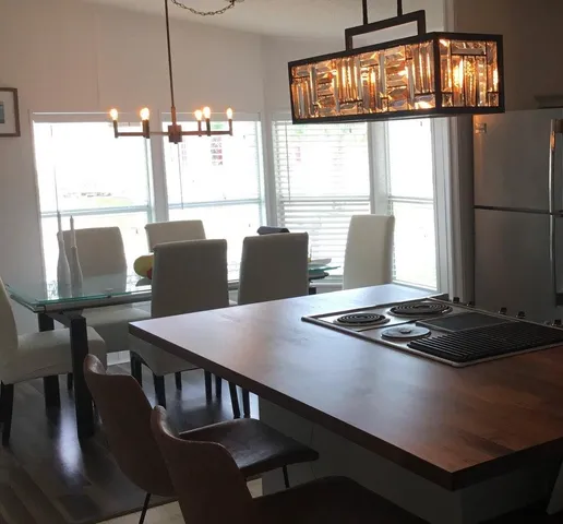 a view of a dining room with furniture window and outside view