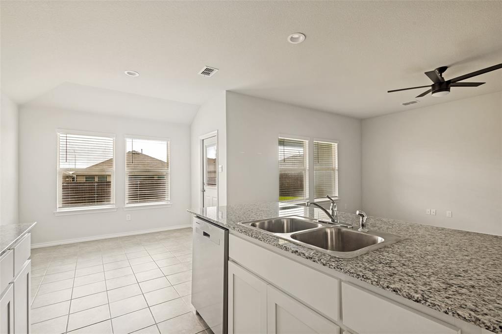621 Spaulding Street Justin, TX 76247 - Photo 11 of 22 a kitchen with sink and window