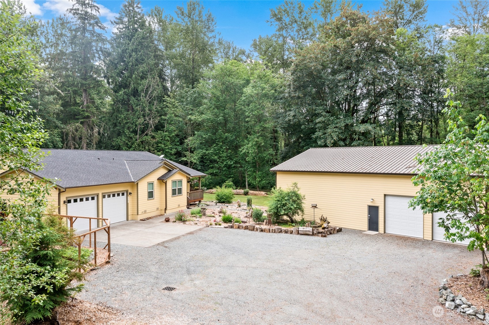 7101 Vandermark Road East Bonney Lake, WA 98391 - Photo 1 of 39 a yellow and red house with a trees in front of it