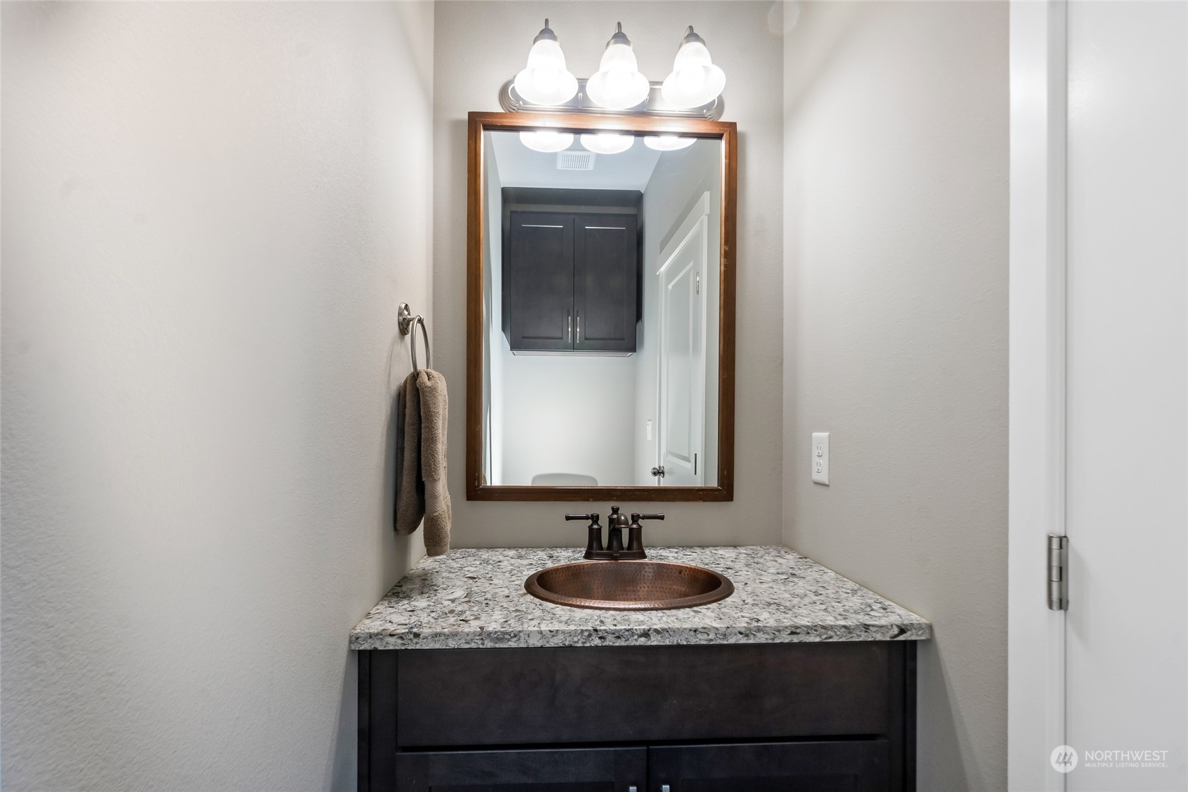 7101 Vandermark Road East Bonney Lake, WA 98391 - Photo 11 of 39 a bathroom with a granite countertop sink and a mirror