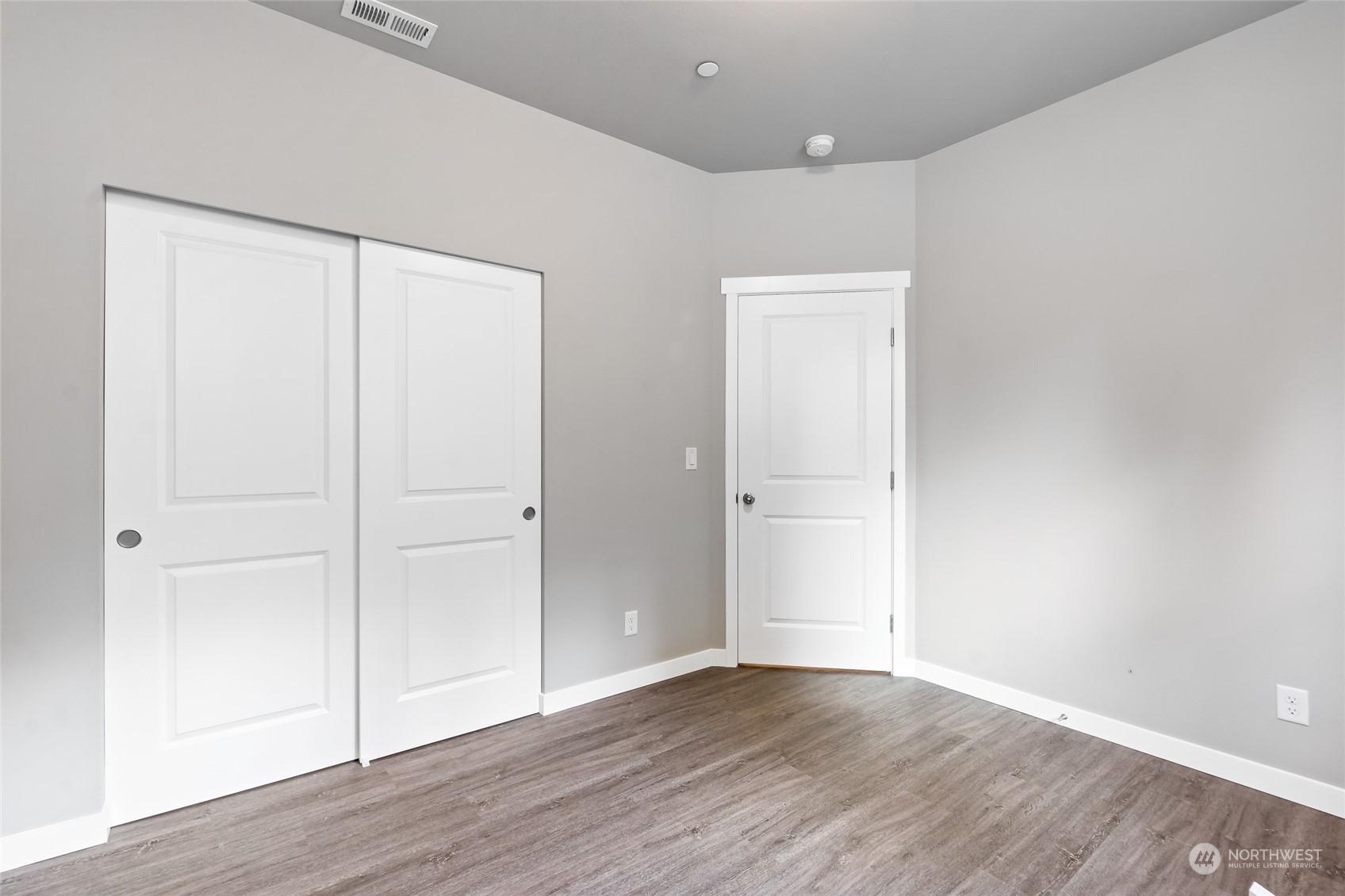 7101 Vandermark Road East Bonney Lake, WA 98391 - Photo 18 of 39 a view of an empty room with wooden floor