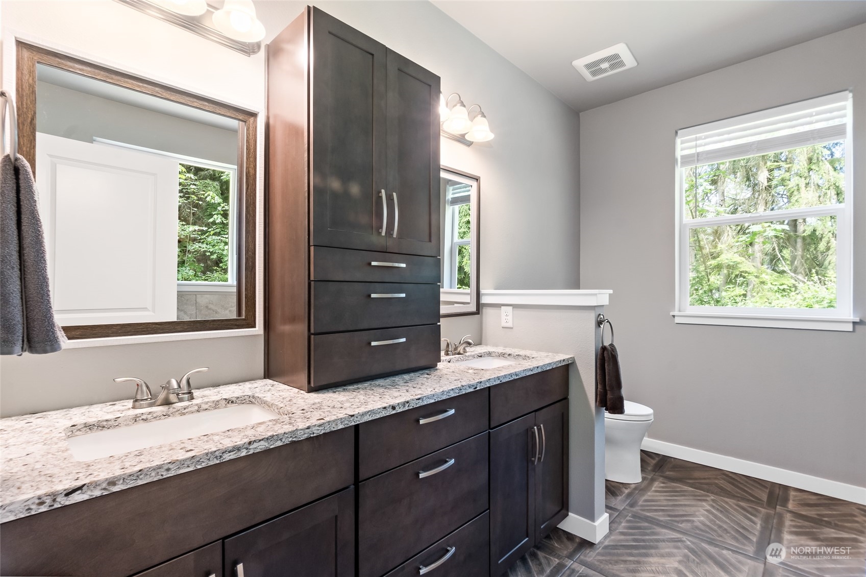 7101 Vandermark Road East Bonney Lake, WA 98391 - Photo 21 of 39 a bathroom with a granite countertop sink a toilet and a window