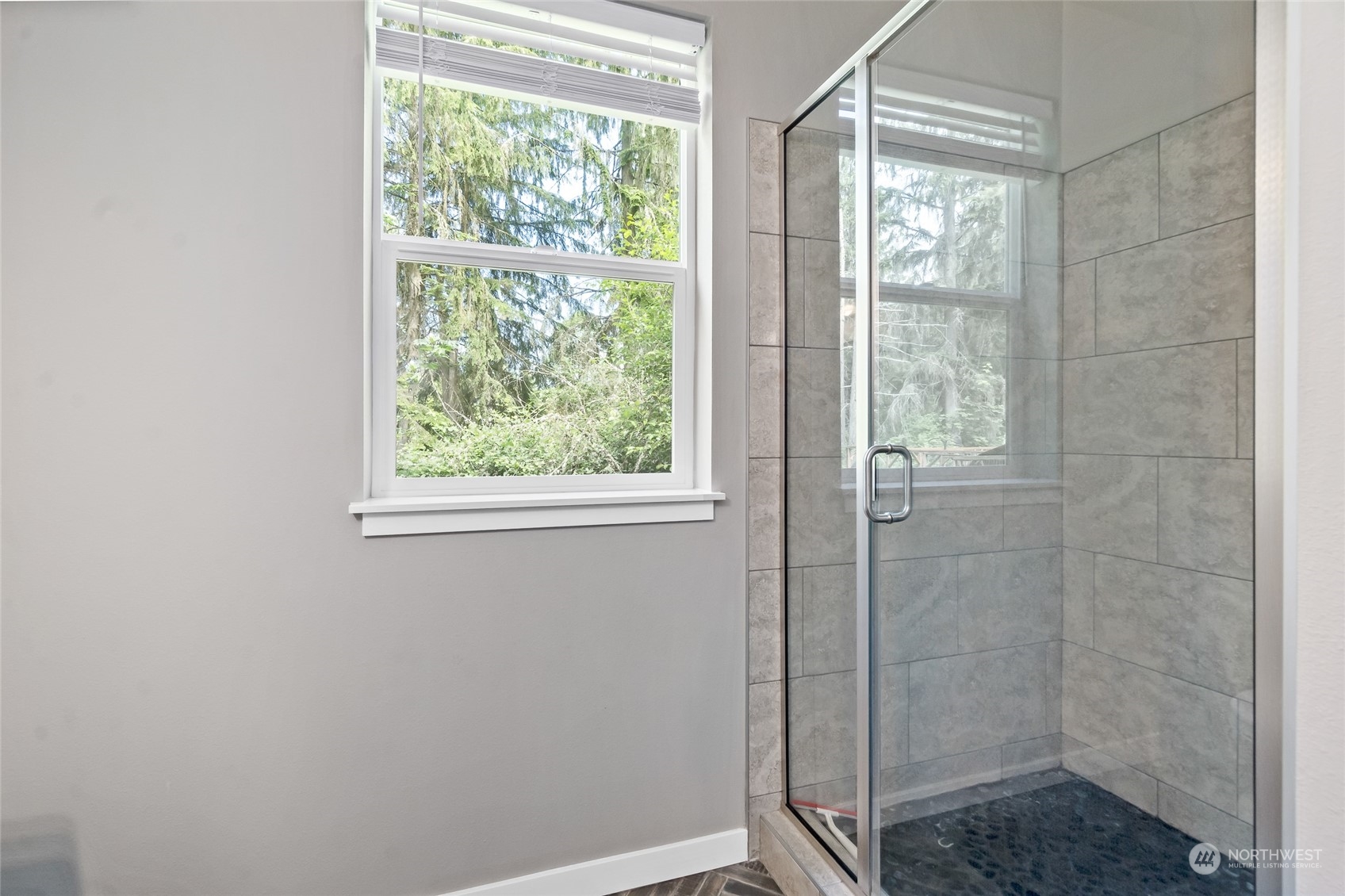7101 Vandermark Road East Bonney Lake, WA 98391 - Photo 22 of 39 a bathroom with a glass shower door