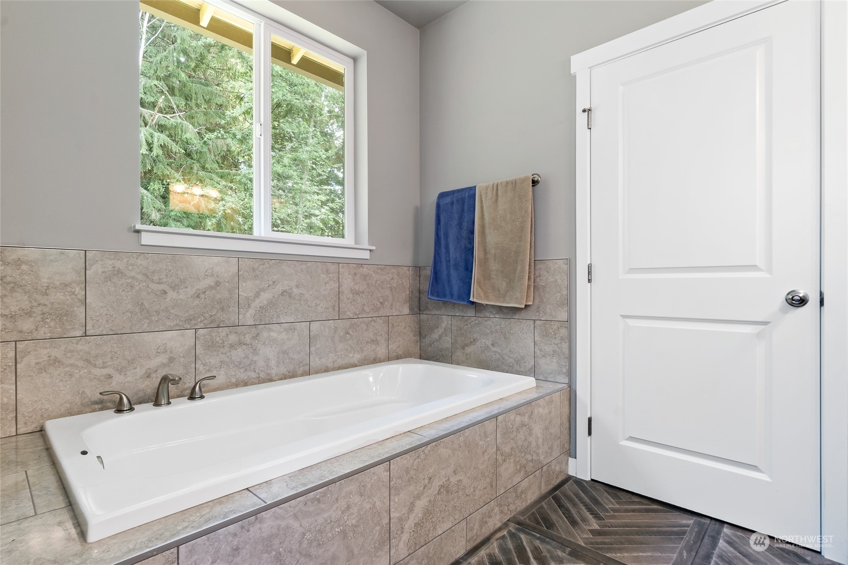 7101 Vandermark Road East Bonney Lake, WA 98391 - Photo 23 of 39 a bathroom with a bathtub and window