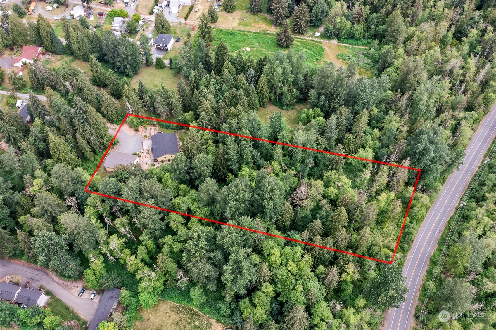 7101 Vandermark Road East Bonney Lake, WA 98391 - Photo 38 of 39 a view of a garden with flowers