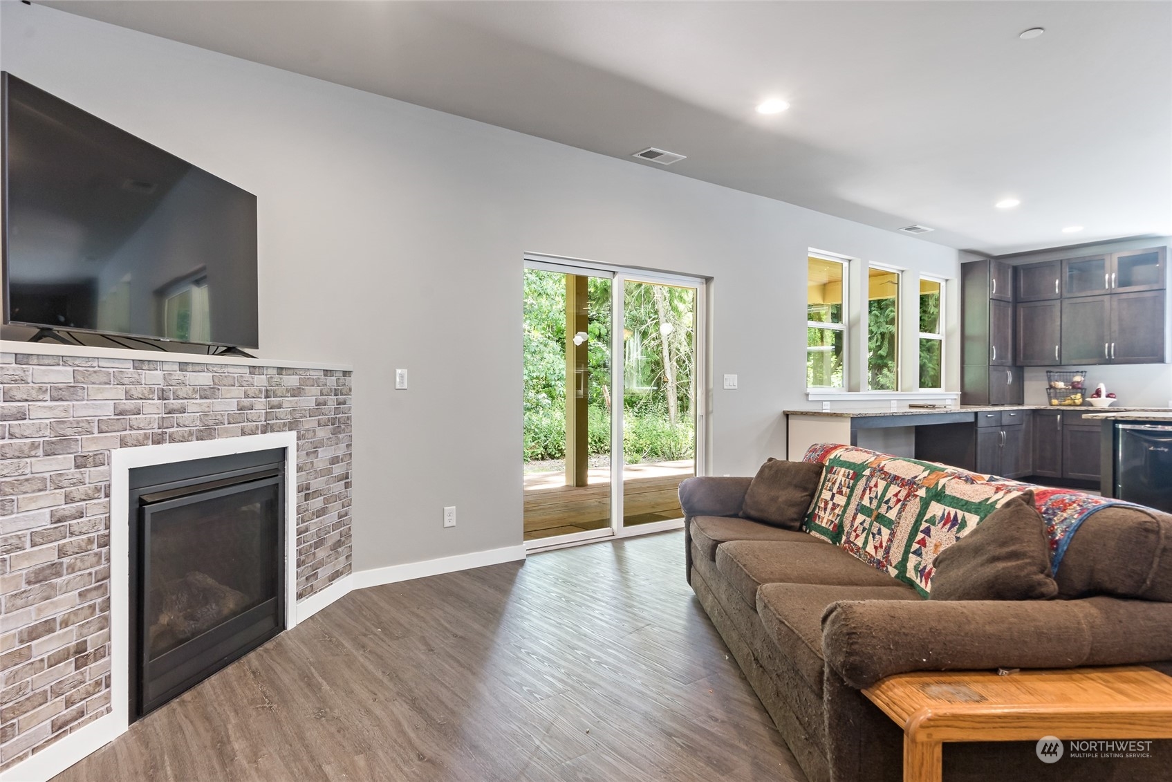 7101 Vandermark Road East Bonney Lake, WA 98391 - Photo 10 of 39 a living room with furniture and a fireplace