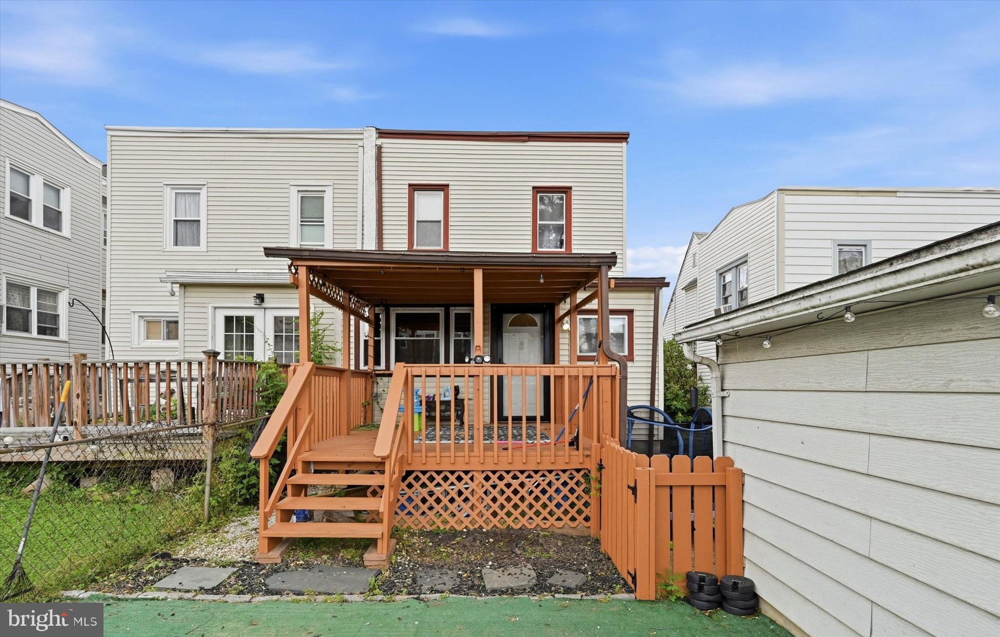 1210 Harding Drive Havertown, PA 19083 - Photo 23 of 25 a view of a house with wooden deck and furniture