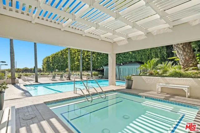 a view of a patio with a table and chairs