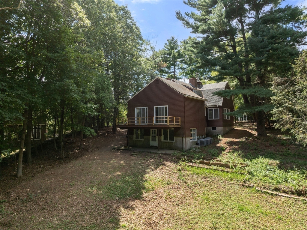 136 Dudley Road Newton, MA 02459 - Photo 22 of 23 a house with trees in the background
