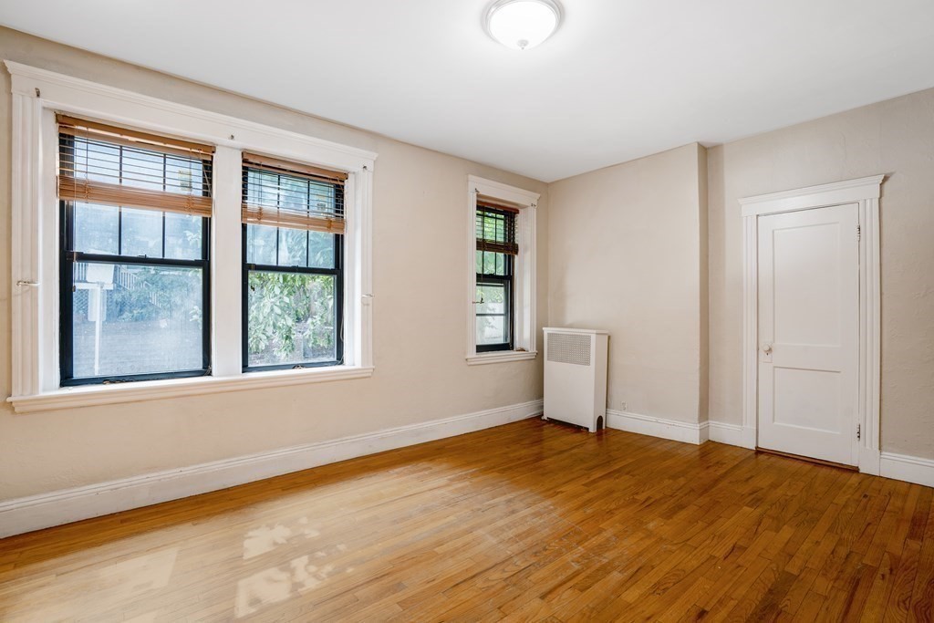 59 Lanark Road, Unit 2 Boston, MA 02135 - Photo 11 of 18 an empty room with a window